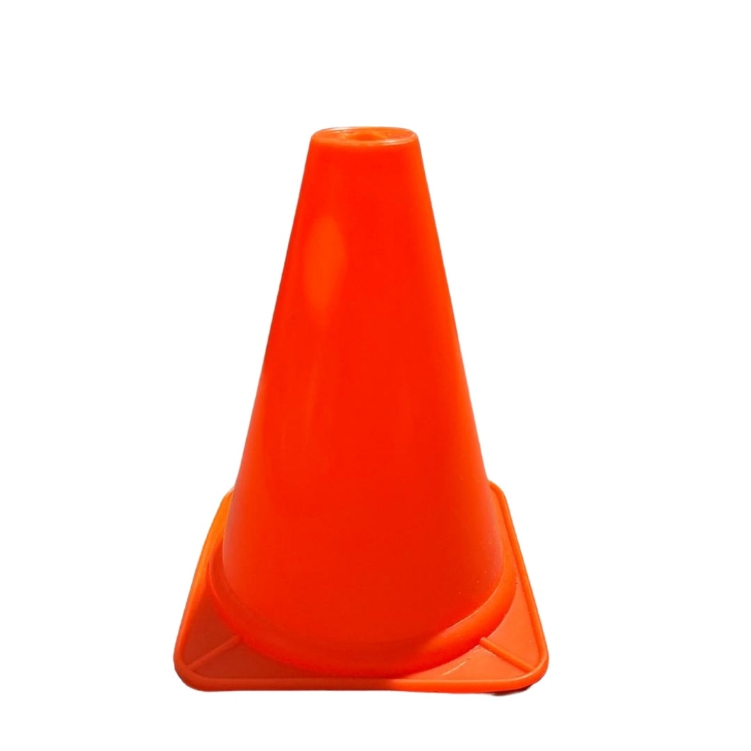 Plastic ground cones used to delineate lanes on a running track for practice.