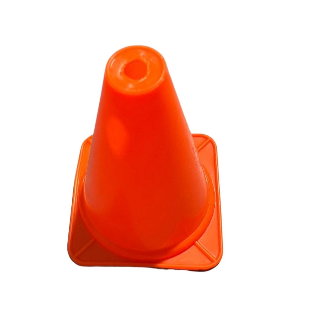 Plastic ground cones used to delineate lanes on a running track for practice.